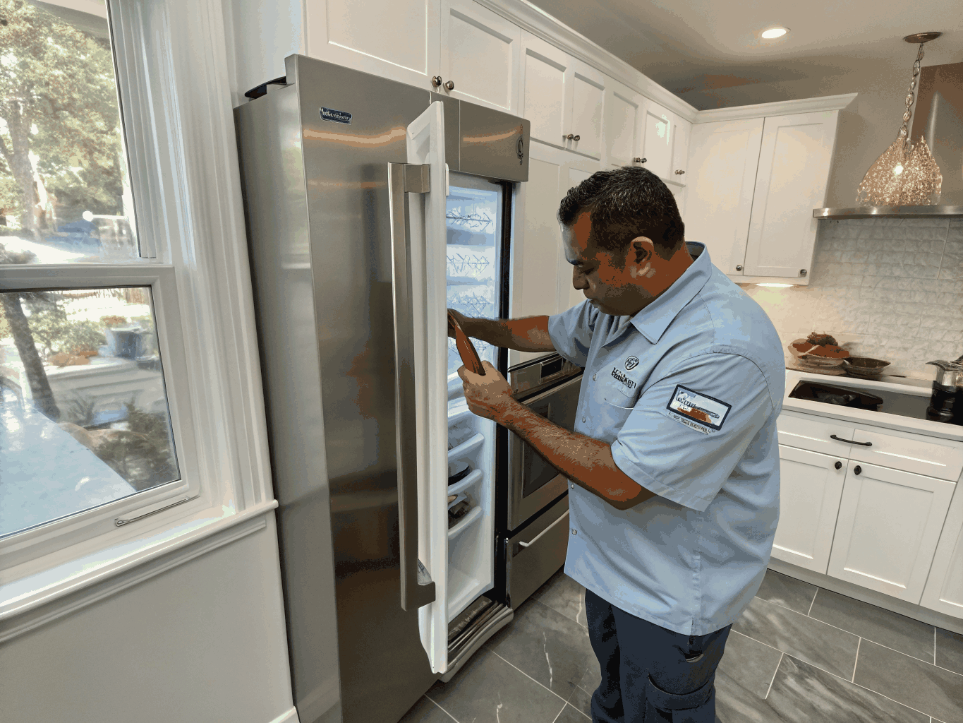 Certified technician servicing a GE kitchen appliance in Kennesaw GA